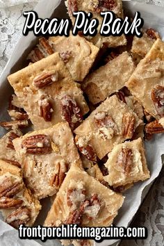 pecan pie bark recipe in a white dish on a lace tablecloth with the words pecan pie bark above it