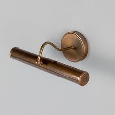 an old fashioned brass toilet roll holder