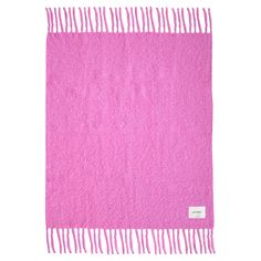 a pink blanket with fringes on it