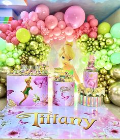 an image of a birthday party with balloons and tinsels on the table in front of it