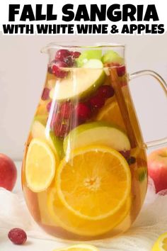 Head on view of fall sangria in a glass pitcher. Fall Sangria Recipes White, Easy Fall Sangria, Apple Sangria Recipes, Fall Sangria Recipes, White Wine Sangria Recipe, Easy Sangria Recipes, Apple Sangria, White Wine Sangria