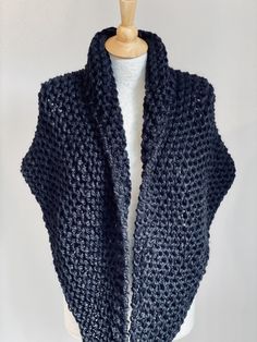 Hand knitted Outlander inspired shawl in black color. - triangle design, can be worn in many different ways - a small button can be attached to one of the tips, so you can secure it in the back for cross body style (if you desire a button, please include you request in a message to the seller at the check out) - super soft 90% acrylic, 10% sheep wool yarn - available in any color or yarn imaginable, please contact me for custom orders -made in smoke and pet free environment The wing span is appr Cozy Black Knitting Pattern For Fall, Black Shawl For Winter, Black Winter Wrap, Cozy Black Knitting Pattern For Winter, Winter Knitting Pattern In Black, Winter Black Knitting Pattern, Black Yarn Knitting Pattern, Winter Hand Knitted Black Knitting Pattern, Black Scarf For Fall