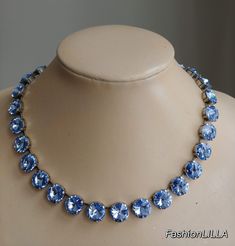 Swarovski crystal light sapphire necklace,baby blue rivoli necklace,blue jewelry,sapphire jewelry,strass necklace,crystal wedding necklace This choker is made with  12mm rivoli cut Swarovski chaton crystals and they are complimented beautifully with the cool tone of the antique silver setting.  Setting is Heavy cast German Brass in antique silver color. It is thick and strong and is manufactured according to EU and US standards; nickel, cadmium and lead free.  Total length of stones is 16 inches Crystal Wedding Necklace, Jewelry Sapphire, Diamond Cluster Earrings, Light Sapphire, Swarovski Crystal Necklace, Anna Wintour, Crystal Light, Necklace Crystal, Necklace Blue