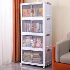 a white book shelf filled with books and stuffed animals