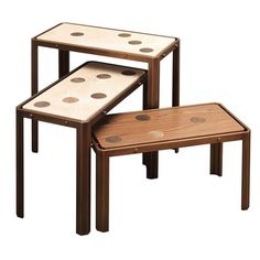 three wooden tables with dots on them and one has a small table top that is attached to it