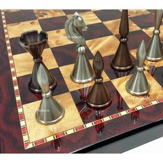 a chess board with metal pieces on it