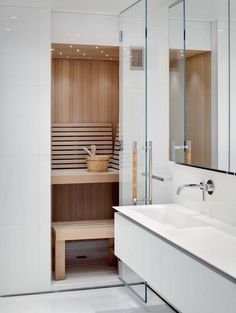 a bathroom with two sinks and a sauna