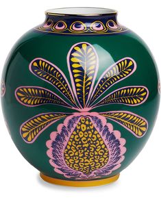 a green vase with colorful designs on it