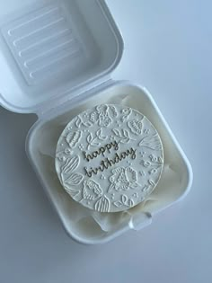 a white plastic container with a happy mother's day cookie in it