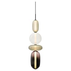 the three lights are hanging from the ceiling in different colors and shapes, each with an acrylic finish