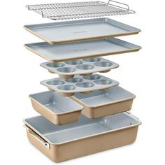 three pans stacked on top of each other with trays in front of them