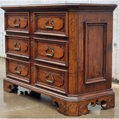 an old wooden dresser with many drawers