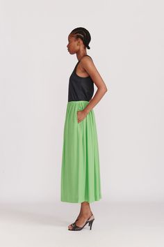 A Gathered ankle length skirt with elastic waistband in an excellent green silk. Hidden pockets and a full lining make this a no-brainer choice for adding this season's color to your palate. This color (Absinth) is also available in the Citron Organic Silk Dress. WHY WE LOVE IT INDRESS was founded in Paris in 2001 by Dutch designer Wies Schulte with the desire to combine elegance, timeless shapes and vibrant colors. Its collections are based on exclusive dyes and carefully selected fabrics, incl Chic Green Dress With Voluminous Skirt, Relaxed Green Pleated Maxi Skirt, Green Relaxed Maxi Skirt For Spring, Green Relaxed Fit Maxi Skirt For Spring, Green Voluminous Tiered Maxi Skirt, Chic Green Long Skirt, Green Summer Dress With Relaxed Skirt, Chic Green Gathered Skirt, Chic Green Gathered Skirt Bottoms