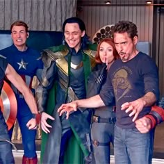 the avengers are posing for a photo together