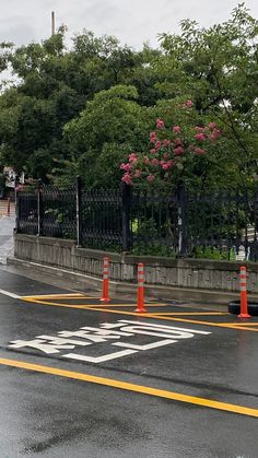 an orange traffic cone sitting on the side of a road