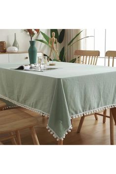 a table with a green table cloth on it