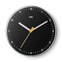 a black clock with yellow hands on a white background