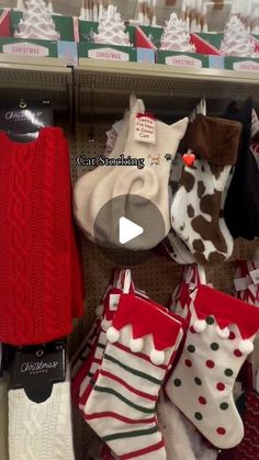 christmas stockings and stocking are on display in a store shelf, with the price tag below them