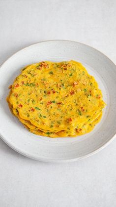 a white plate topped with food on top of a table