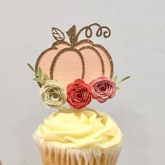 a cupcake with frosting and flowers on top