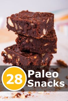 three brownies stacked on top of each other with the words 28 paleo snacks