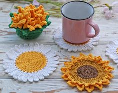 crocheted coasters with coffee cup and flowers