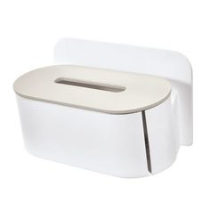 a white toilet sitting next to a wall mounted tissue dispenser on a white background