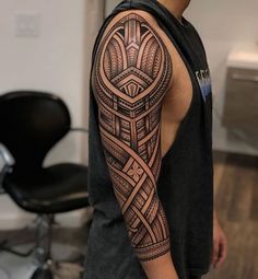 a man with a tattoo on his arm