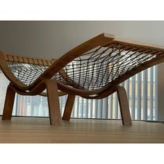 a wooden chair sitting on top of a hard wood floor