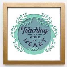 a framed paper art with the words teaching is a work of heart