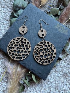 Introducing our stunning Boho Wood Earrings, meticulously crafted to add a touch of bohemian charm to your everyday style. These earrings are a fusion of natural elegance and contemporary design, making them a versatile accessory for any occasion. Each pair of earrings is intricately laser-cut from high-quality wood, resulting in unique patterns that reflect the beauty of nature. The lightweight yet durable construction ensures comfort throughout the day, allowing you to effortlessly showcase yo Laser Engraved Earrings, Material Earrings, Earrings Hanging, Engraved Earrings, Hanging Earrings, Lightweight Earrings, Wooden Earrings, Wood Earrings, Light Weight Earrings