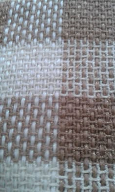 the fabric is brown and white in color