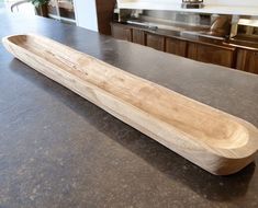 a wooden object sitting on top of a counter