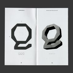 an open book with the letters q and q on it's pages, in black and white