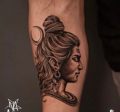 a woman's arm with a black and white tattoo design on the left forearm