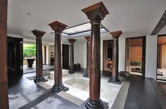 an empty room with columns in the middle