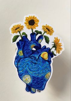 a heart shaped sticker with sunflowers in the center and blue body painted on it