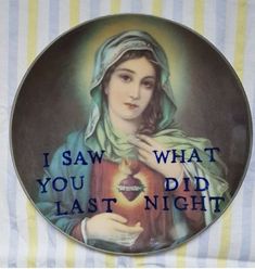 a plate with an image of a woman holding a lit candle and saying i saw what you did last night