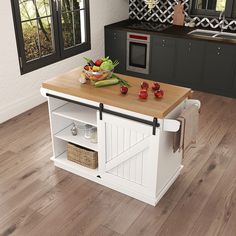 a kitchen island with cutting board and vegetables on it