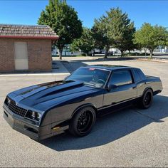 a black car parked in a parking lot