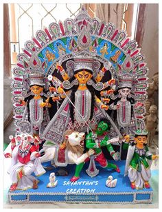 an elaborately decorated statue of hindu deities