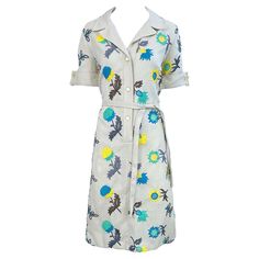 Wonderful early 1970s PETER STEVENS Irish linen khaki embroidered short sleeve shirt dress ! Features embroidered flowers in cobalt blue, turquoise, green, yellow, brown, and grey. Buttons up the front. Tie belt at waist. Very well made, with heavy attention to details. Can easily be dressed up for any day or evening event. Pair with wedges, flats or sandals for day, and heels for evening. In great condition Made in USA Approximately Size Large Measurements: 40 inch bust 34.5-36 inch waist 40 in Dresses 1980s, Short Sleeve Shirt Dress, 70s Shirts, Vintage Dress 80s, Nautical Dress, Short Sleeve Dress Shirt, Irish Linen, Turquoise Green, Tweed Dress