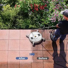 a young boy sitting on top of a tiled roof