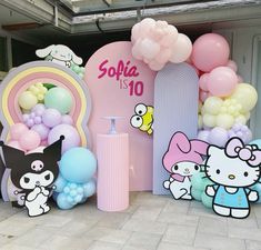 hello kitty themed birthday party with balloons and decorations