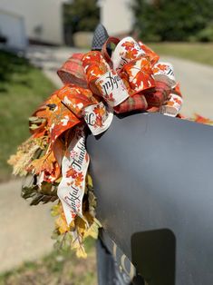 a wreath on the side of a mailbox