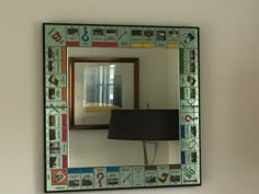 there is a mirror with many different things on it and a lamp next to it