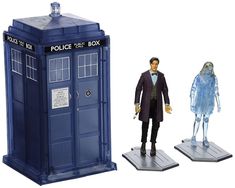 two action figures are shown in front of a tardish and doctor who appear to be dressed as the same person