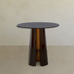 a round table with two brown and black bases