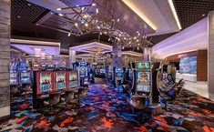 a casino room with several slot machines in it