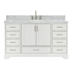 a white bathroom vanity with marble top and drawers